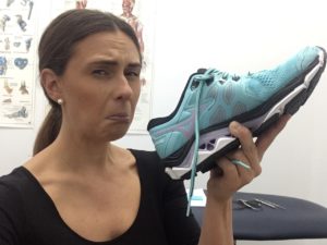 Hannah smelling a stinky shoe